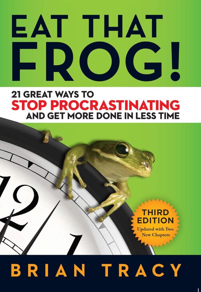 Cover of Eat That Frog, with a frog hanging off of a clock. 